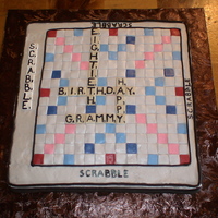 Scrabble Grammy's unfinished Scrabble cake. I wanted to do the details such as double triple word and letter score written on the blocks but my...