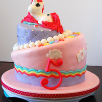 My Little Pony Cake Bottom Tier: WASC with Orange Mango Cream Cheese Filling. Top Tier: Chocolate Cake with Caramel Filling. All fondant.