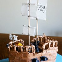 Pirate Ship Cake Aye! The cake gods have put me in my place once again. The Pirate Ship is finished. Enjoy Me Heartys! Everything is fondant/gumpaste except...