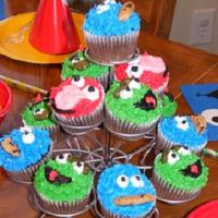 Sesame Street Cupcakes elmo, cookie monster and oscar cupcakes.