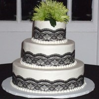 Round Wedding Cake Round wedding cake with buttercream icing, lace, and fresh flowers. It's not leaning, it was the camera ...