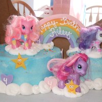 My Little Pony Cake This was for my Niece's 4th Birthday. Besides the ponies being toys, the raonbow, hearts, & stars are all fondant. The clouds are...