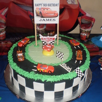 Cars 1/2 choc and 1/2 vanilla 16 inch cake with BC filling. Covered in MMF.