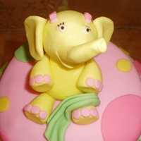 Elle Phant Tay 3 tier 1/2 choc 1/2 vanilla cake with buttercream filling. Covered in MMF and decorated to match color scheme. Elephant made out of 1/2...