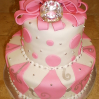 Bling Bling 2 tier 1/2 choc 1/2 vanilla cake with BC fillling. The bride designed the cake from top to bottom. Please ignore the droopping bows they...