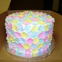 Flowers WASC with Sugarshacks buttercream. Flowers are gumpaste with sugar pearl centers.