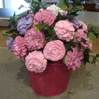 My First Cupcake Bouquet This was my first try at a cupcake bouquet. I had one casualty at the house which was replaced before transport and one casualty during...