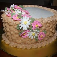 Basket-Weave Cake Finale cake for Wilton Course 2. Yellow cake with butter-cream icing. Royal icing flowers. The basket-weave was very tedious. But over all...