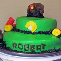 Turkey Hunting Cake cake covered in fondant, with fondant figures
