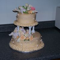 My Final Cake In Wilton Class My first wedding cake. All the flowers I handcrafted out of gum paste.
