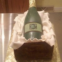 Wine Bottle Cake The wine bottle is made out of chocolate and the label is an edible image that has the recipient's picture on it. The box panels are...