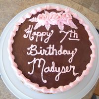 Daughters Birthday Double laver marble cake with chocolate frosting and pink roses! My writing needs a bit more practice, My daughters name is Madysen not...