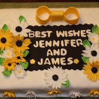 Daises And Sunflowers I made this cake for one of my father's co-workers that was getting married. I usually hate sheet cakes but this one was a lot of fun...