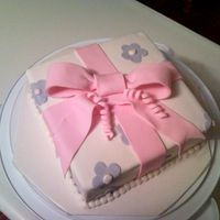 Course 3 - Present Cake This is the first cake you make in course 3. Fondant covered with bow and flowers.