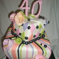 40Th Whimsy This was for a woman's 40th birthday. Buttercream iced with fondant appliques. Gumpaste topper & calla lillies.