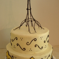 Paris Yellow cake with fondant decorations. Hubby made topper.