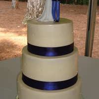 1St Wedding Cake This is my first wedding cake - for a friend of a co-workers sister. Vanilla cake with buttercream icing, blue fabric ribbon and pearls on...