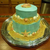 Beachy Birthday Cake Two tier, bottom is vanilla with chocolate icing and top is chocolate with vanilla icing... molded white chocolate seashells, brushed with...