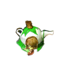 Tinkerbell's Tea Pot House Smash Cake This was the smash cake for my daughter's 1st birthday. My son had to jump in the pic, of course, so I had to crop it!