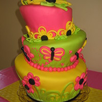 Quilled Flowers, Butterflies, And Hearts This cake was made for a Bridal & Baby Shower combination. The bride-to-be combined her bridal shower with a baby shower for her sister...