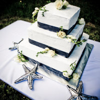 Black And White Wedding cake I did in July 2010. SMBC and real flowers upon brides request!The brides aunt who was transporting the cake got rear-ended on...