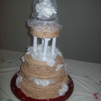 Mom's Wedding Cake This was my first attempt at a stacked and wedding cake. Other than putting my hand hand marks in the bottom back in the process of...