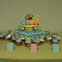 Noah's Ark I made this for a baby shower. The cake turned out smaller than planned, so I added cupcake "waves" with animals around the ark....
