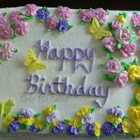 Flowers And Butterflies. This is a cake I made for my sister. The butterflies were an experience. It was my first time. They are not perfect but I took notes : )...