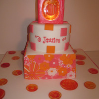 Rainbow Sherbet This was for a birthday. The box on top is make of gumpaste and sugar glass, with a candle glowing from the inside.