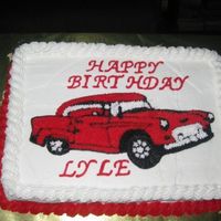 N147200781_30211928_3924704.jpg Buttercream icing. I used the piping gel transfer of the car to the cake.