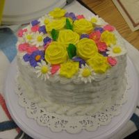 N147200781_30211926_4936477.jpg Royal Icing flowers made in class. Basket weave- buttercream icing.