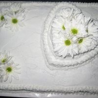 Wedding Cake My first wedding cake. :) It was for my nephew's wedding. They just wanted something simple, and they loved it! I put real daisies on...