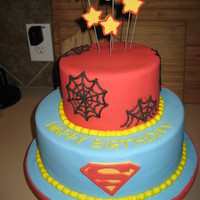 Superhero Birthday Cake super hero cake for a childs 3rd birthday.. covered in fondant. The bottom tier has a superman cape coming off of the backside
