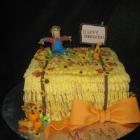 Haystack With Scarecrow Buttercream with fondant accents. Thankyou to the cakes on CC that I stole your idea!