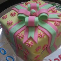 Present Cake My first fondant cover cake. Chocolate cake fondant bow. Need so much practice :)