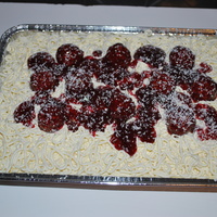 Spaghetti And Meatballs W/sauce Buttercream icing, ferrero rocher meatballs and strawberry sauce.