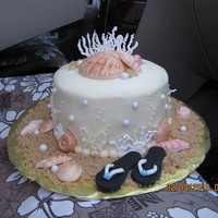 Day At The Beach Carrot cake with cream cheese frosting. Shells are white chocolate. Fondant accents.