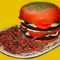 Hamburger Cake I hate the way this pic out I used all of the yellow to cover up the background lol, the cake was so cute and I had a lot of fun making it...