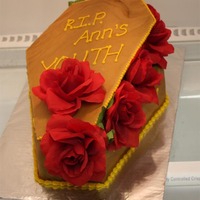 Coffin Cake Fondant with silk flowers, inside was turtle cake. This cake was ordered by a husband for his wife's 50th birthday, she loved it :)
