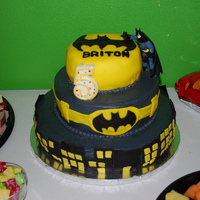 Batman Cake Made this 3 tier cake for my son's 5th birthday. The top tier is covered in yellow fondant (this was my first time working with...