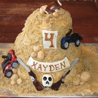 All My Favorite Things... A cake for a four year old who requested a 4-wheeler, dirt bike, skull, shotguns and a football.
