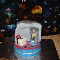 To Boldy Go Where No Cake Has Gone Before. White cake covered in fondant and Scotty is also made out of fondant he getting ready to bean Captain Kirk up.