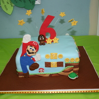 Mario Cake 10" sqaure, covered in fondant. Inspired by several CC cakes, mostly jaklotz1. And thanks to CakeMommyTX for posting instruction on...