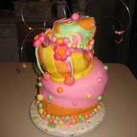 My Mom's Birthday Cake. My first topsy turvy cake. Layers were 8", 6", & 4". My advice for next time - bake a dense cake. :-)