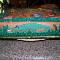 Jungle Theme Jungle theme cake I made for my school teacher niece for first graders on first day of school. Cake covered in buttercream with animals cut...