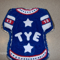 Tye's Cake Chocolate cake with buttercream and fondant accents