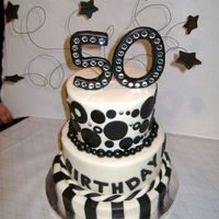 50Th Birthday My first tiered cake and second time working with fondant. I was happy with how it turned out. 10" 8" and 6". All covered...