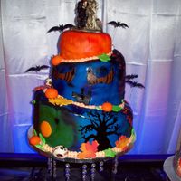 Halloween Wedding Cake my first whimsical cake. top and bottom tier golden yellow cake with buttercream filling and middle tier spice cake with cream cheese...
