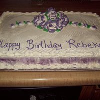 Rebekah's Birthday golden yellow cake with raspberry filling and white buttercream icing. Violet two tone roses.