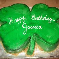 4 Leaf Clover golden yellow cake, choc buttercream filling and white butter cream icing. Airbrushed border. I carved this from a half sheet cake.